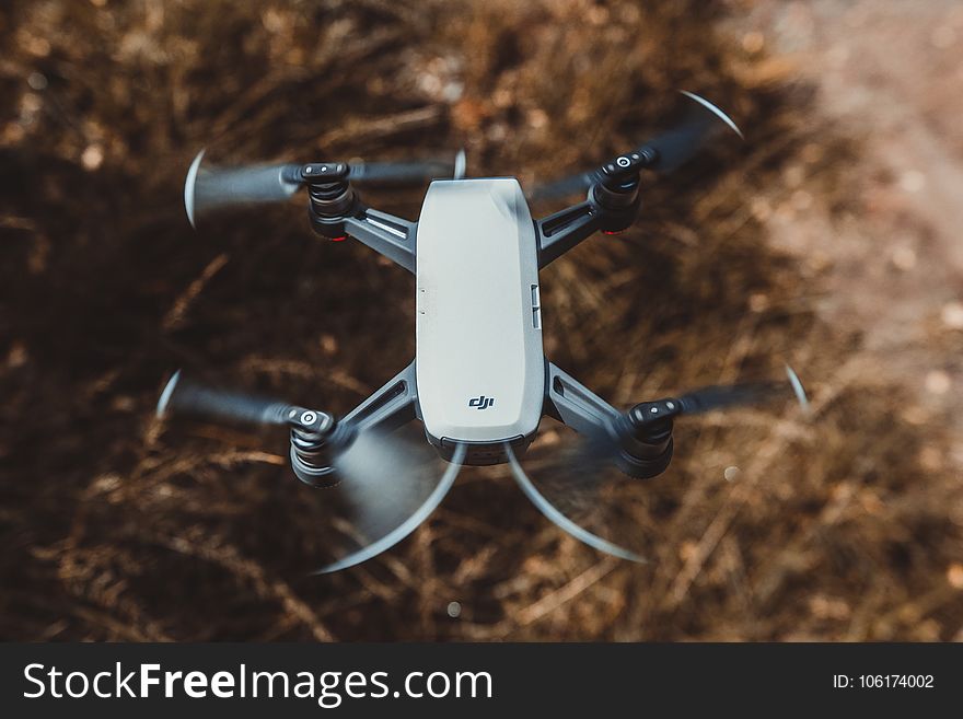 Selective Focus Photography of White and Black Quad Copter