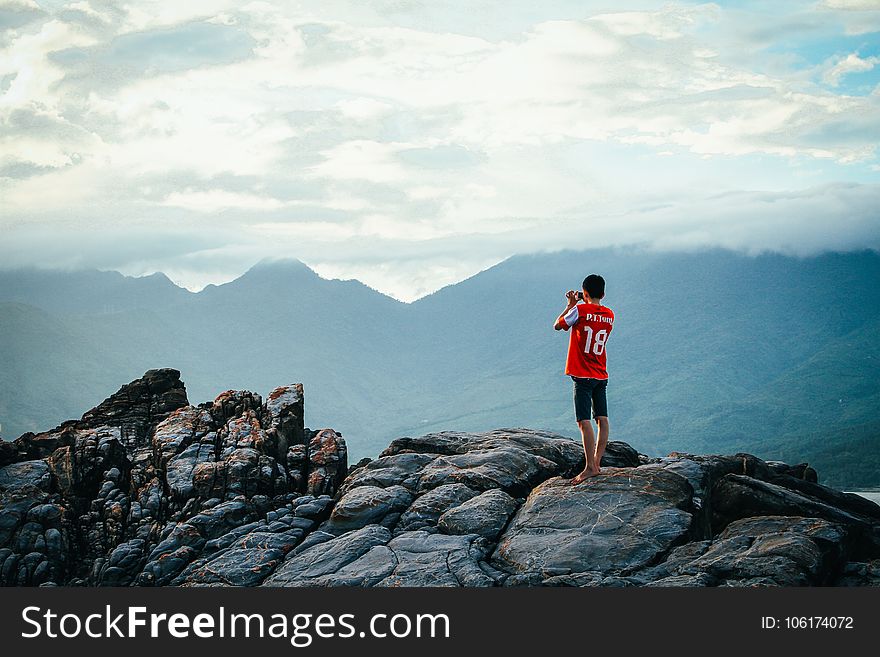 Man Having A Picture On Rock