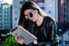 Beauty Girl Reading News On The Tablet On A Beautiful Spring Day Outside Royalty Free Stock Image Beauty Girl Reading News On The Tablet On A Beautiful Spring Day Outside Royalty Free Stock Image