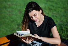 Happy Beautiful Girl Reading A Book On Sunny Spring Day On A Bench In Nature Royalty Free Stock Images Happy Beautiful Girl Reading A Book On Sunny Spring Day On A Bench In Nature Royalty Free Stock Images
