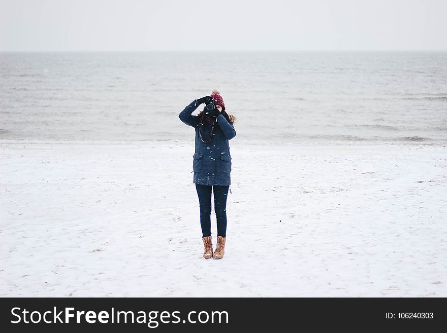 Woman Taking Picture on the Beach View