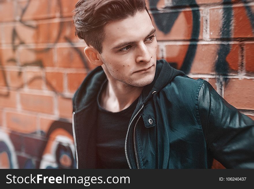 Close-up Photography of Man Wearing Leather Jacket
