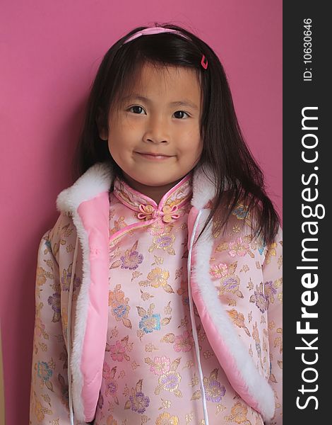 Little chinese girl with pink silk dress