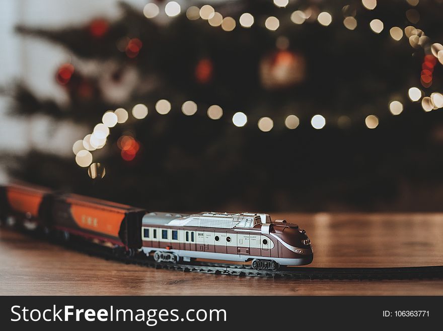 Shallow Focus Photography on Gray Train Plastic Toy