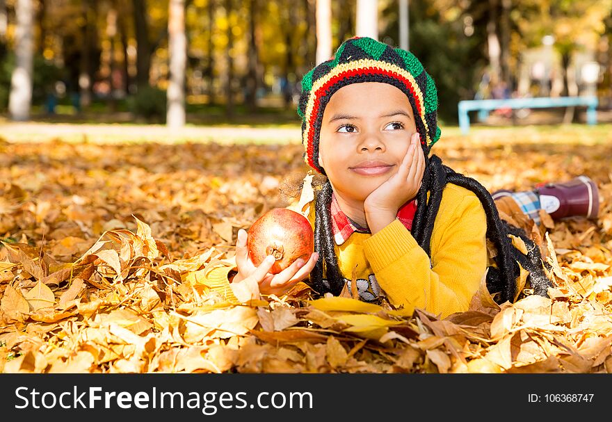 Autumn Portrait Of African American Beautiful Child. Happy Little Black Boy With Leaves In The Park In Fall.