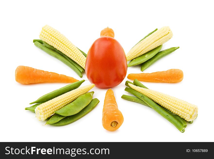 Healthy eating - fresh baby vegetables mix with carrots, beans, corn and tomato. Isolated over white background. Healthy eating - fresh baby vegetables mix with carrots, beans, corn and tomato. Isolated over white background.