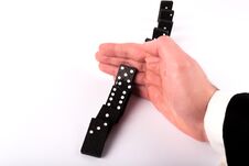 Businessman Hand Stopping Dominoes Row From Falling On White Table Stock Photography Businessman Hand Stopping Dominoes Row From Falling On White Table Stock Photography