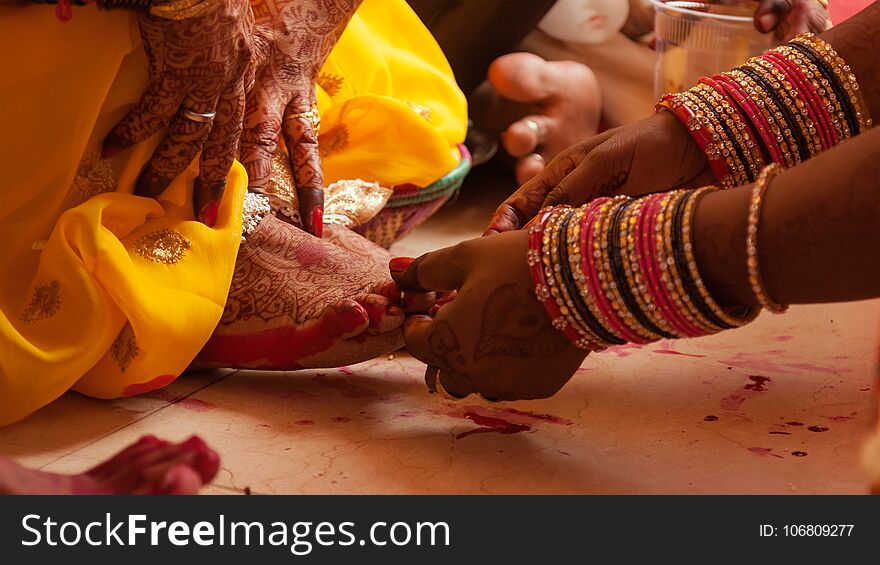 Bride feet coloring ceremony, a Hindu wedding ritual
