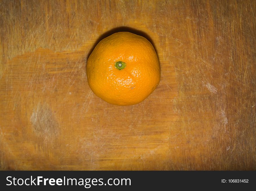 Orange On A Cutting Board