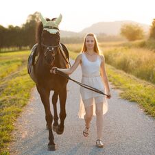 Beautiful Young Woman With Horse Outdoor On A Walk In Nature Royalty Free Stock Photography