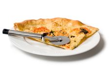 Slice Of Pizza On White Plate With Pizza Cutter Royalty Free Stock Photography