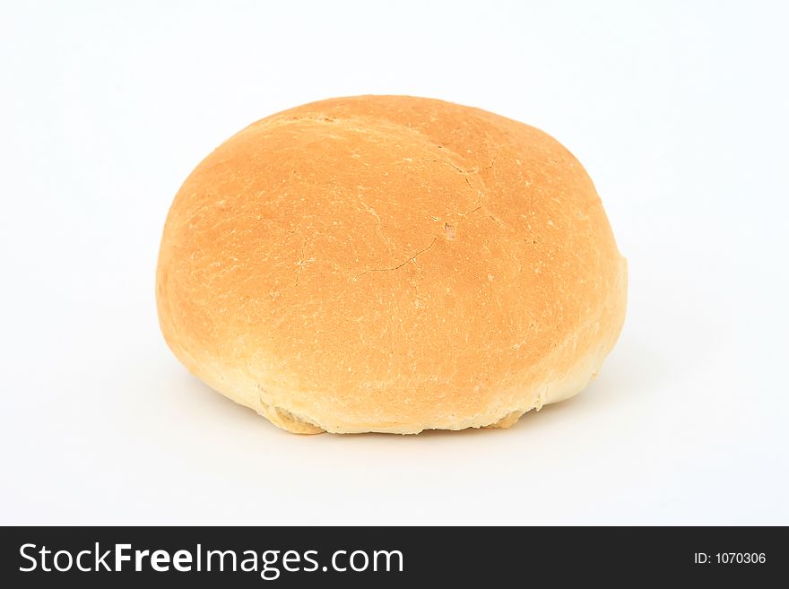 Healthy plain brown bread roll, close-up over white, isolated, macro, closeup, shallow dof. Healthy plain brown bread roll, close-up over white, isolated, macro, closeup, shallow dof