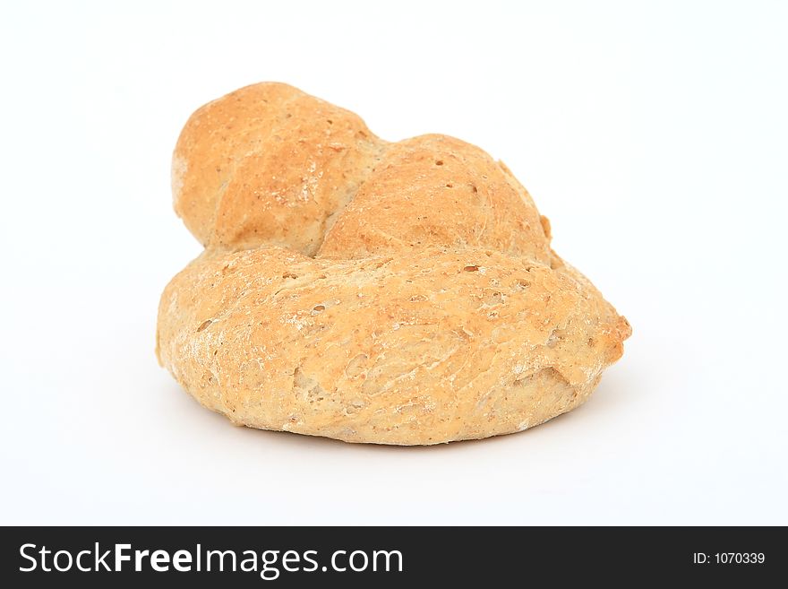 Healthy plain brown bread roll, close-up over white, isolated, macro, closeup, shallow dof. Healthy plain brown bread roll, close-up over white, isolated, macro, closeup, shallow dof