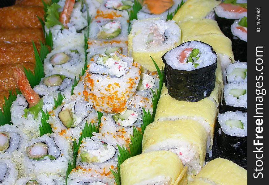 A platter of various kinds of sushi...shrimp tempura, california rolls, salmon rolls, cucumber rolls, and the house special. A platter of various kinds of sushi...shrimp tempura, california rolls, salmon rolls, cucumber rolls, and the house special