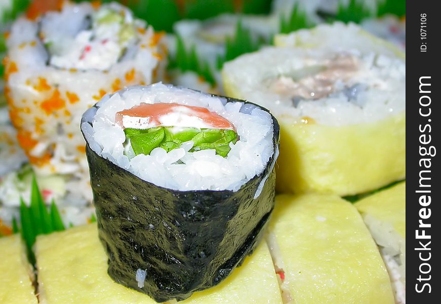 A platter of various kinds of sushi...shrimp tempura, california rolls, salmon rolls, cucumber rolls, and the house special. A platter of various kinds of sushi...shrimp tempura, california rolls, salmon rolls, cucumber rolls, and the house special