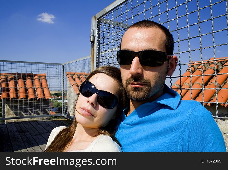 Lady on his shoulder with sunglasses. Lady on his shoulder with sunglasses