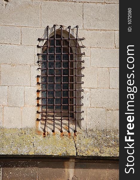 A tight old grid on an ancient window. A tight old grid on an ancient window