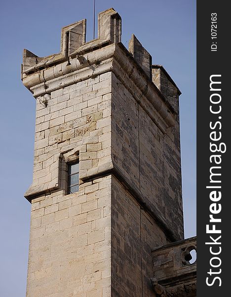 Low-angle shot of an ancient square watchtower. Low-angle shot of an ancient square watchtower