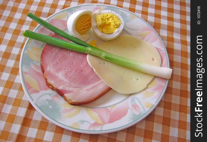 Traditional domestic Easter food in Croatia: boiled ham, cheese, young green onion, boiled eggs. Traditional domestic Easter food in Croatia: boiled ham, cheese, young green onion, boiled eggs...