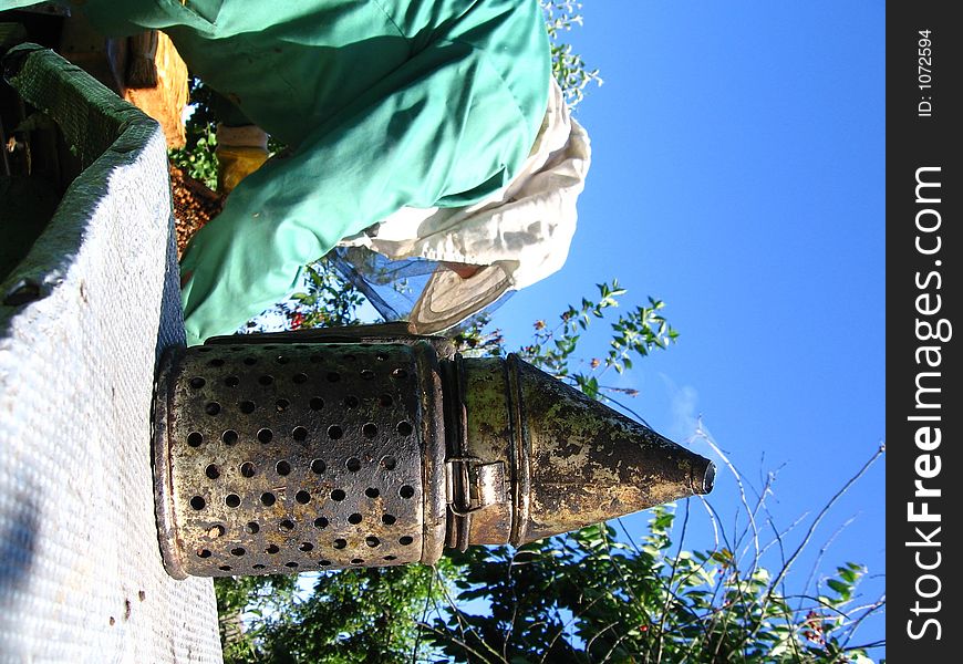 A beekeeper at work on his hive. A beekeeper at work on his hive