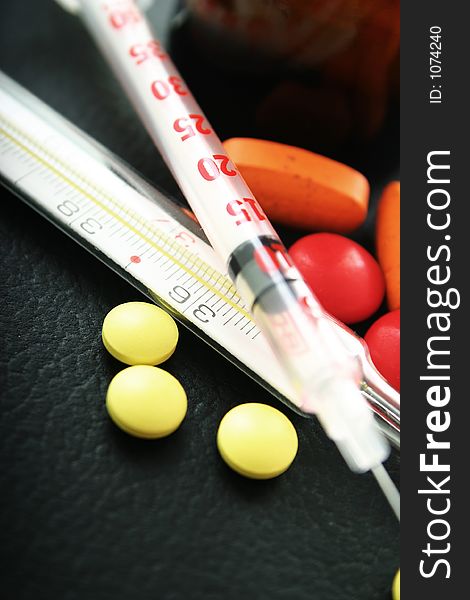 Pills, Syringe And Thermometer