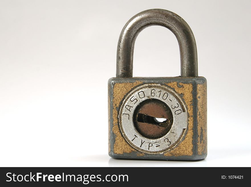 Closed padlock isolated over white