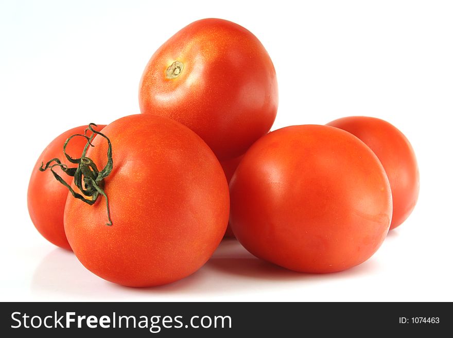 Red tomatoes isolated over white background