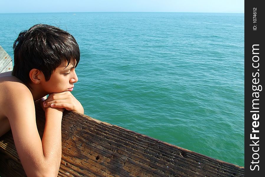 Boy looking out over the ocean. Boy looking out over the ocean