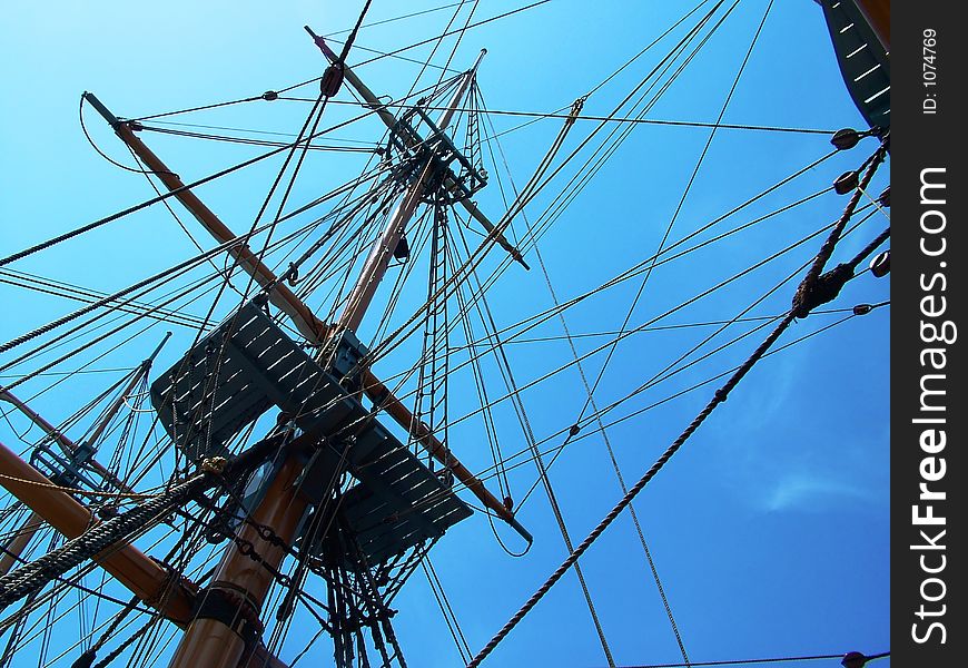 Shipping rigging against blue sky. Shipping rigging against blue sky