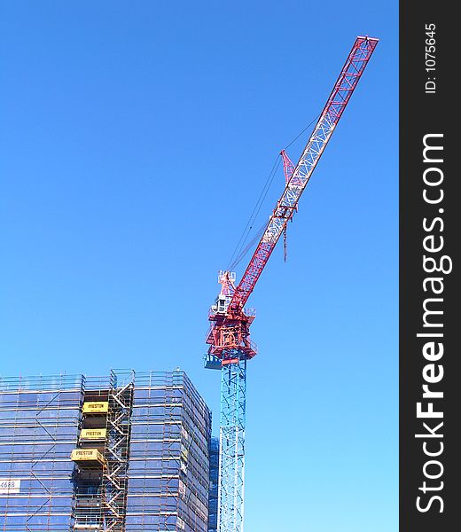 Crane on top of a building. Crane on top of a building