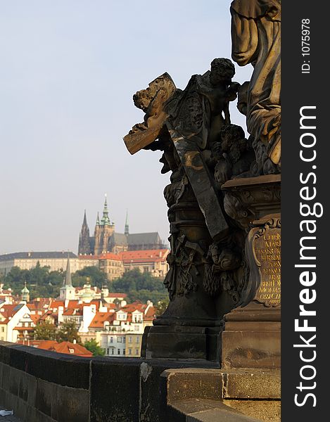 Statue on charles bridge and the Prague castle