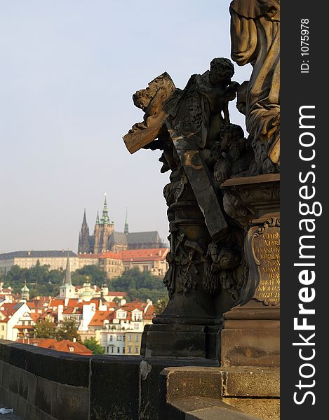 Statues of Charles bridge  andPrague castle - beautiful scene in old prague city. Statues of Charles bridge  andPrague castle - beautiful scene in old prague city