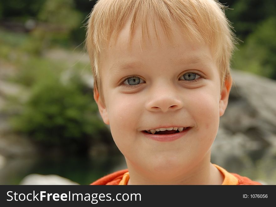 Young child portrait photographed outdoors. Young child portrait photographed outdoors