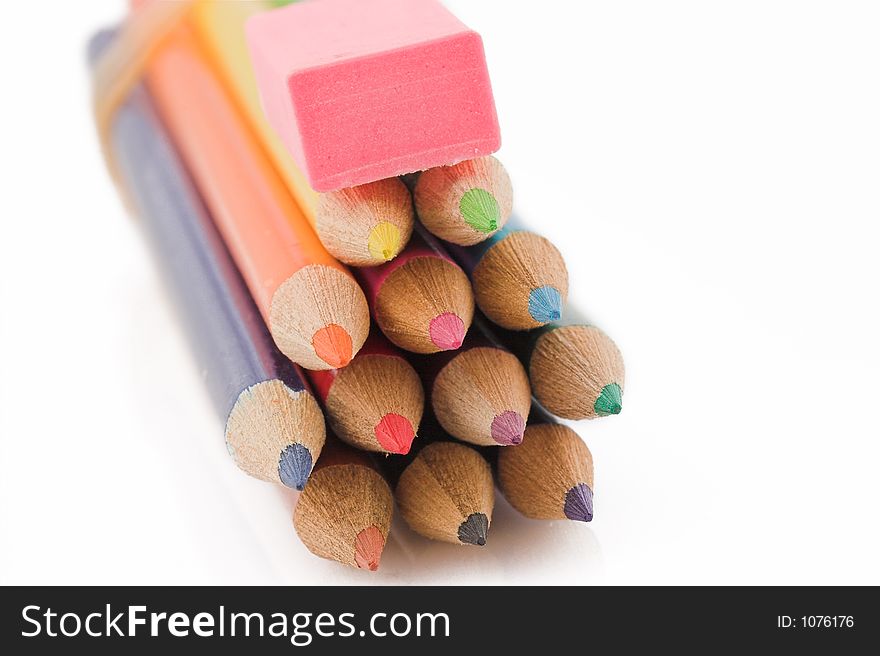 Pencils and eraser stacked on top