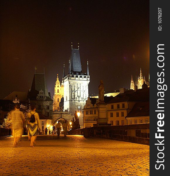 Charles bridge tower at night - mysterious scene in old prague city. Charles bridge tower at night - mysterious scene in old prague city