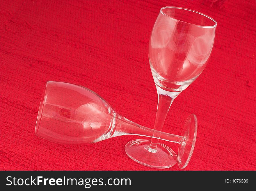 Wine glasses on red background