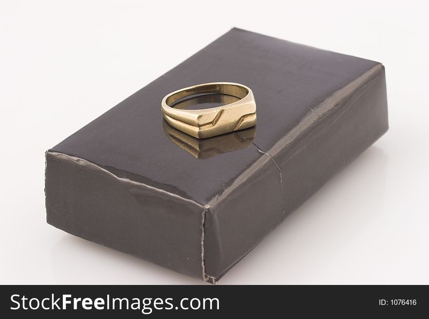 Wedding ring on black box