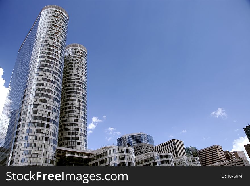 Panorama of few round skyscrapers over blue sky. Panorama of few round skyscrapers over blue sky