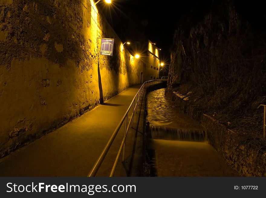 Path along wall at night