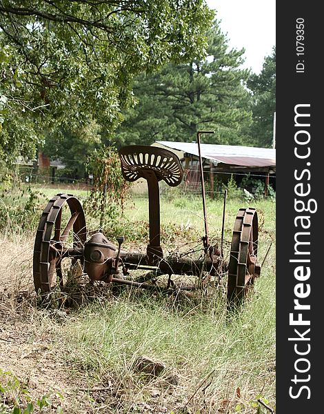 Antique farm equipment in a field. Antique farm equipment in a field