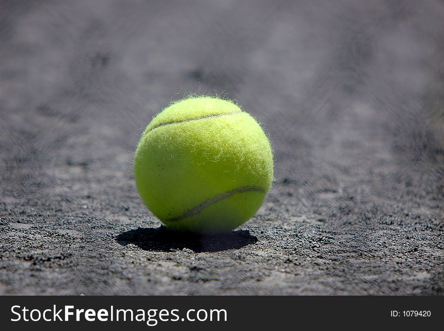 Tennis ball on ground close-up