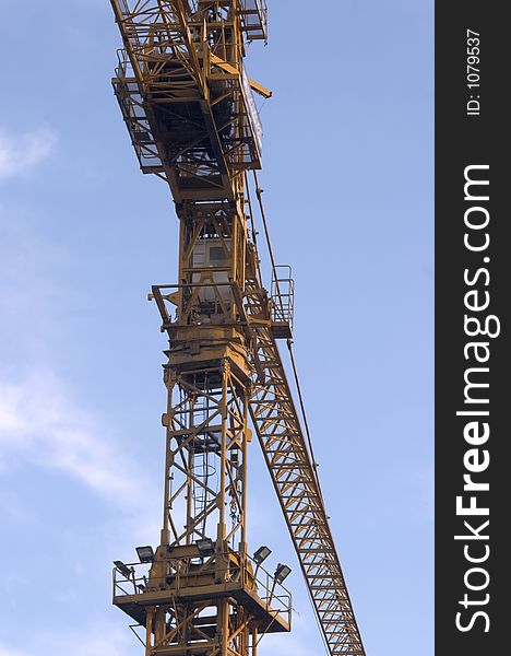 Construction crane with blue sky as a background