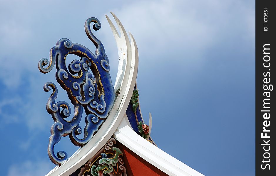 An ornament on the rooftop of a chinese temple. An ornament on the rooftop of a chinese temple.