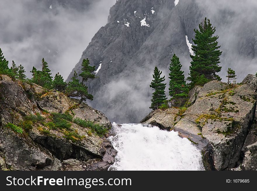 Big waterfall and mountain. Altay. Russia.