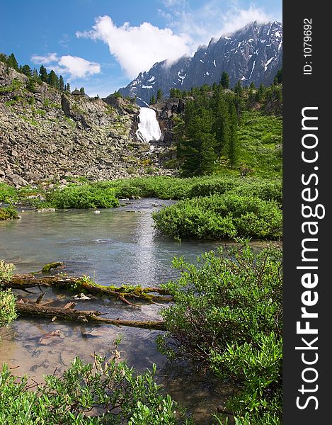 Big waterfall and mountain. Altay. Russia.