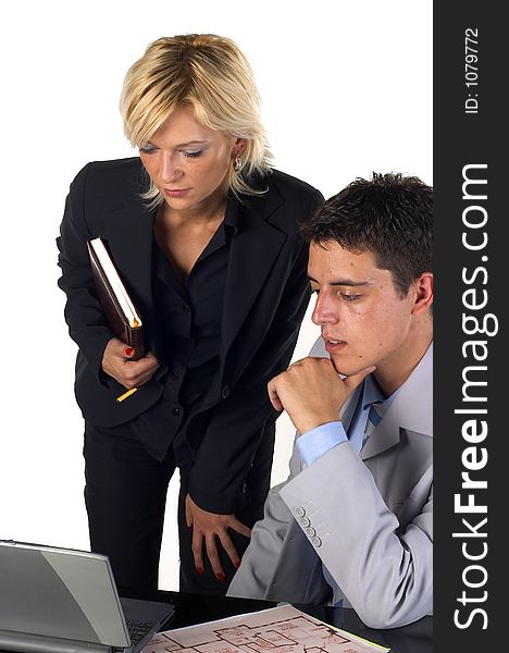 Businessman working at his desk and talking to a secretary. Businessman working at his desk and talking to a secretary