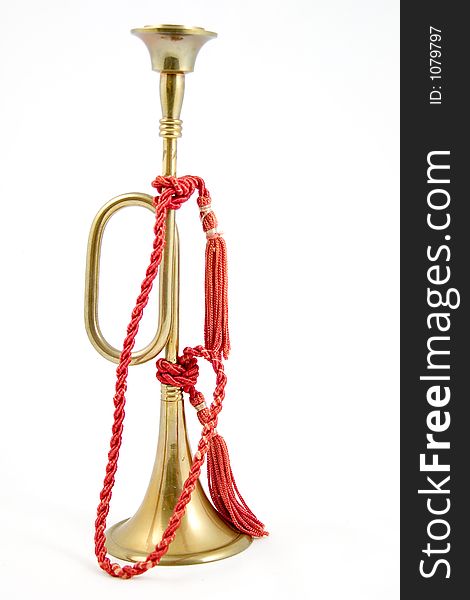 Brass bugle with red rope. Brass bugle with red rope.