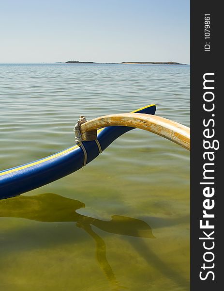 Pirogue on water on beautyfull beach