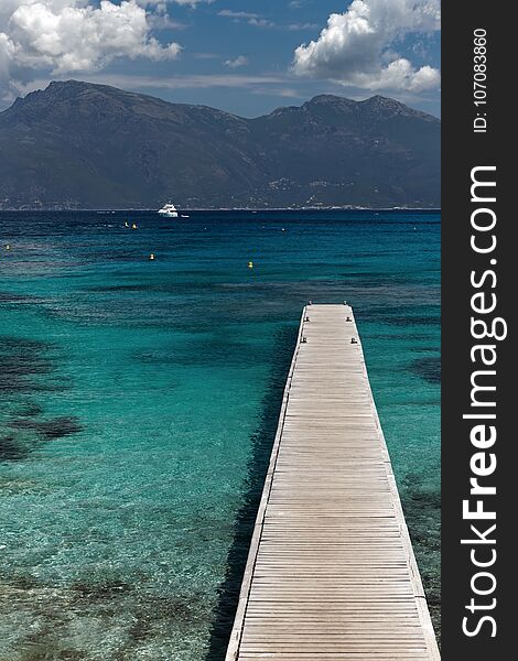 Wooden pier on desert of Agriates coast in Corsica island. Wooden pier on desert of Agriates coast in Corsica island