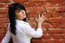 Woman Near The Brick Wall Stock Images Woman Near The Brick Wall Stock Images